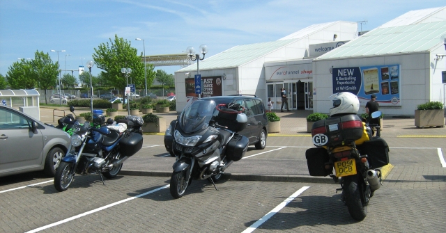 my bikes and 2 others parked outside the shop complex at the channel tunnel on the english side